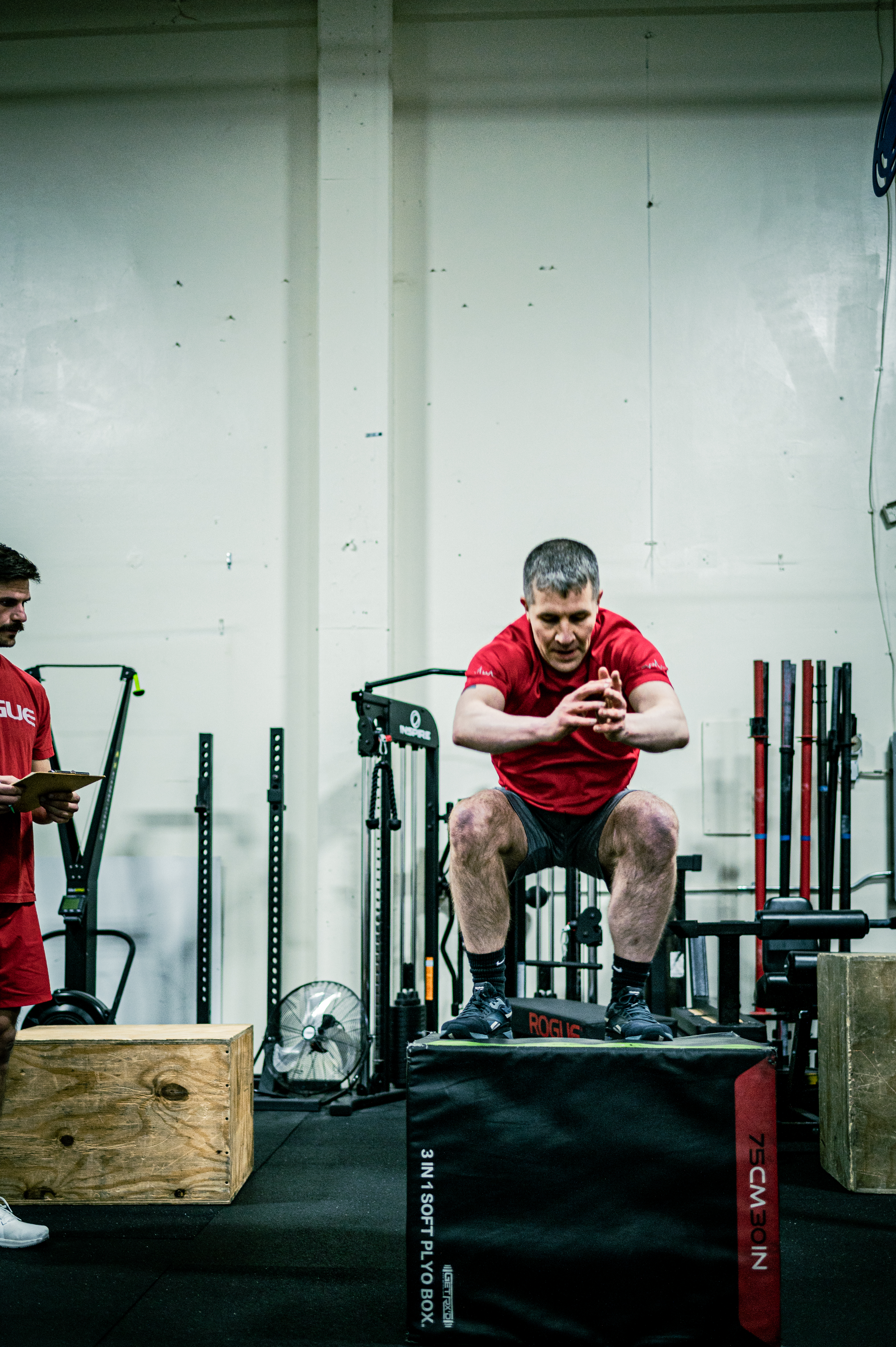 Athlete performing a box jump during a CrossFit class at CrossFit Tigard in Tigard, Oregon
